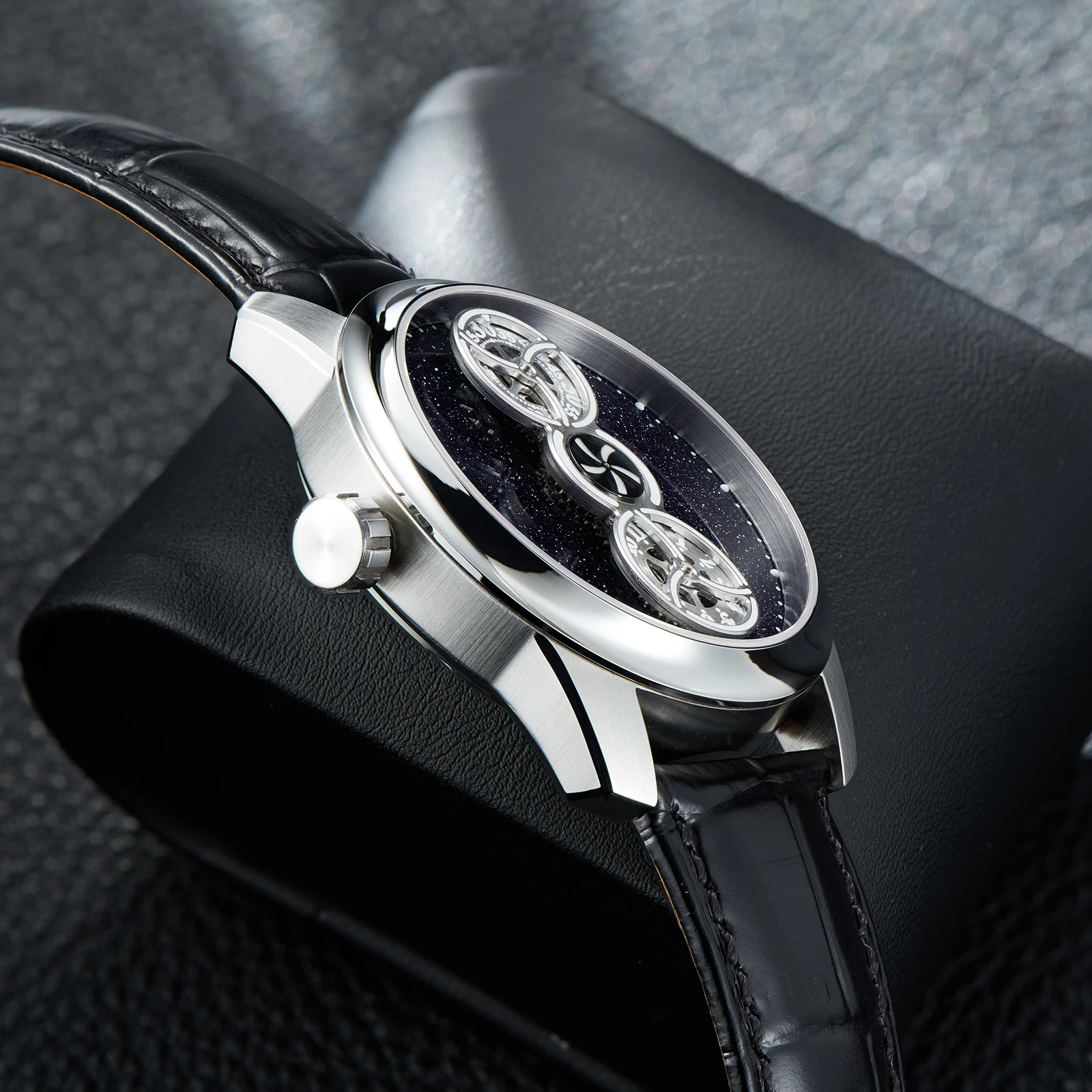 Luxury automatic watch showcasing intricate star design with moonphase elements