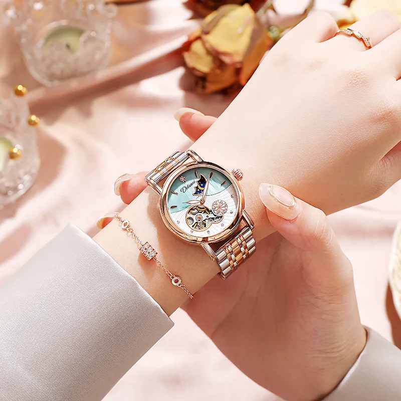 Women's moonphase watch with elegant diamond accents on stainless steel bracelet